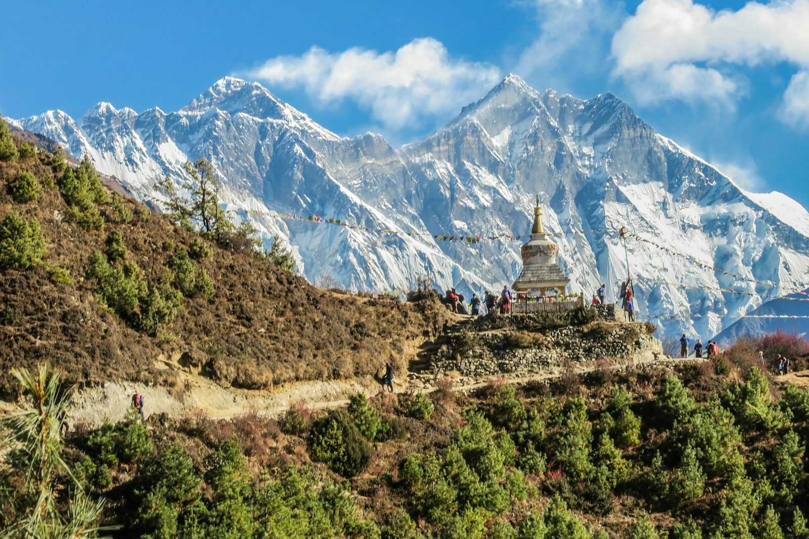 Snow peaks and a hillside stupa in the Nepal Himalaya